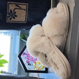 Fuzzy white slippers